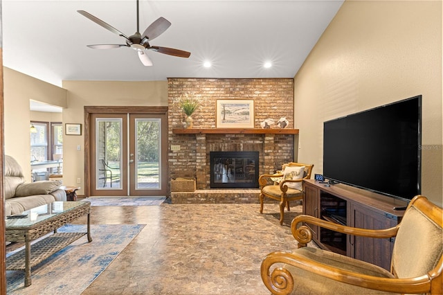 living room with french doors, a brick fireplace, and ceiling fan