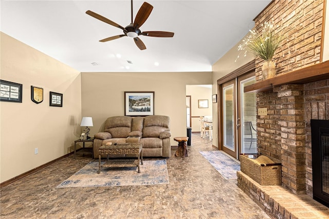 living room with a fireplace and ceiling fan