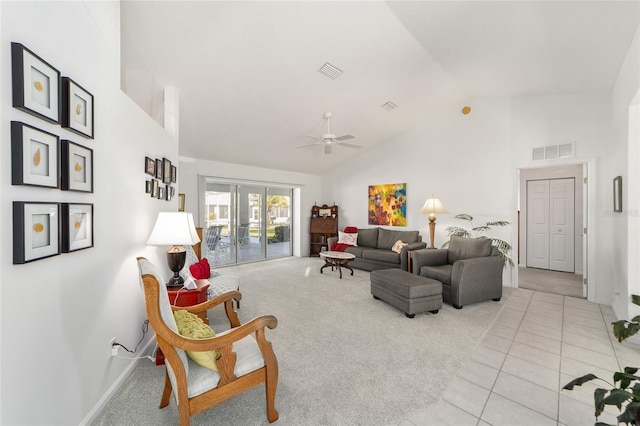 living room featuring high vaulted ceiling, ceiling fan, and light tile patterned flooring