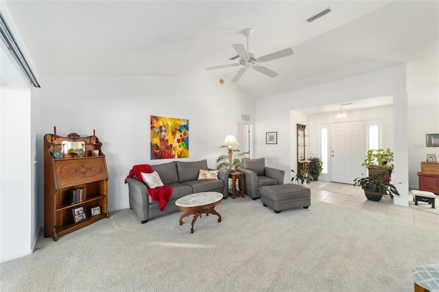 tiled living room featuring vaulted ceiling and ceiling fan