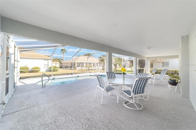 view of patio / terrace featuring a lanai