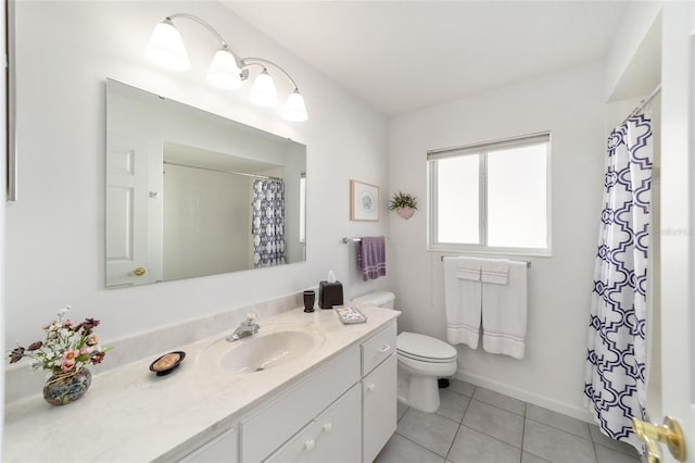 bathroom featuring tile patterned floors, vanity, a shower with shower curtain, and toilet