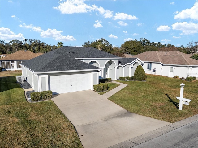 single story home featuring a garage and a front yard