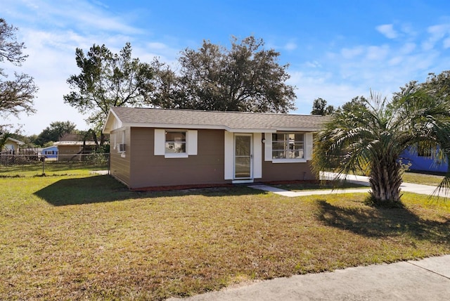 single story home featuring a front yard