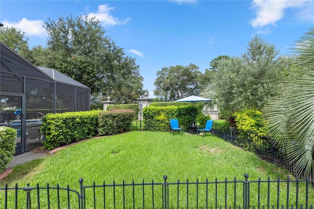 view of yard featuring a lanai