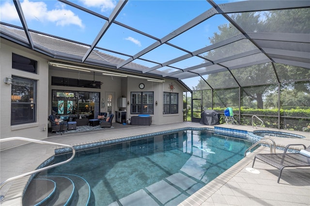 view of pool featuring an in ground hot tub, a lanai, ceiling fan, a patio area, and a grill