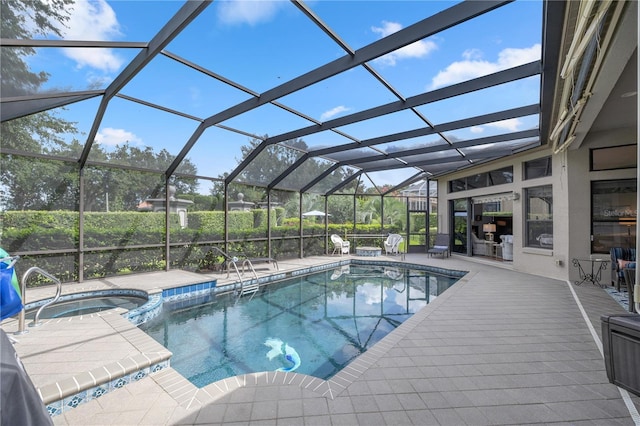 view of swimming pool with glass enclosure and an in ground hot tub