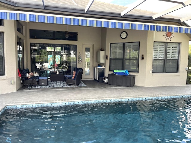 view of pool featuring ceiling fan and a patio