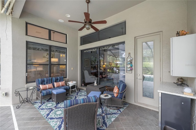 view of patio / terrace with an outdoor living space and ceiling fan