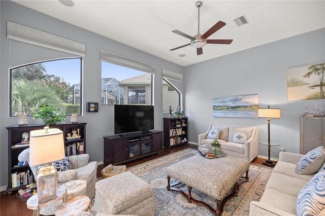 living room with hardwood / wood-style floors and ceiling fan