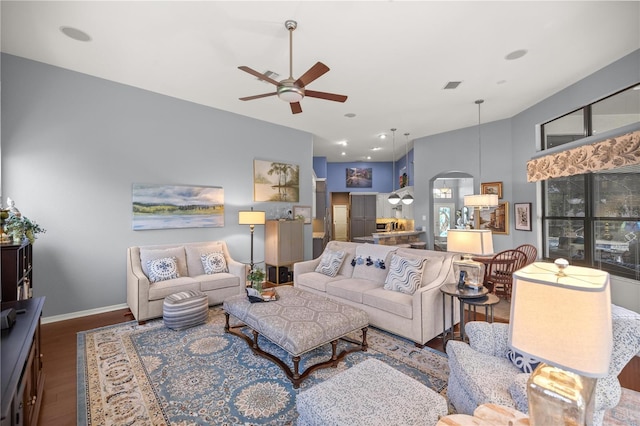 living room featuring hardwood / wood-style floors and ceiling fan