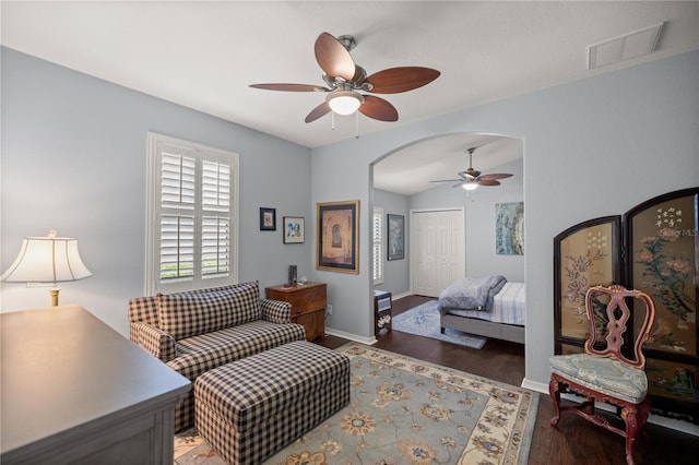 bedroom featuring dark hardwood / wood-style flooring, a closet, ceiling fan, and lofted ceiling