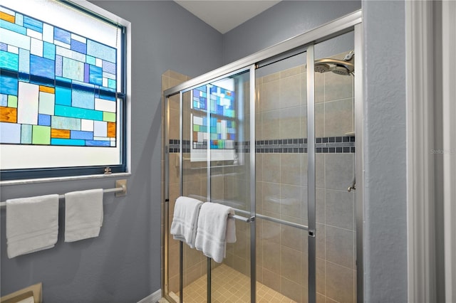 bathroom featuring an enclosed shower