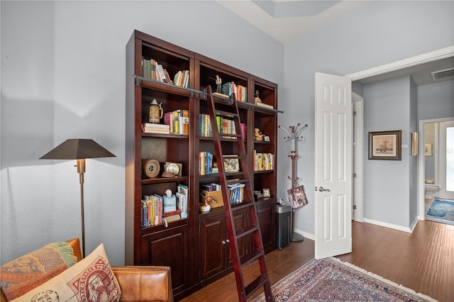 living area with dark hardwood / wood-style flooring