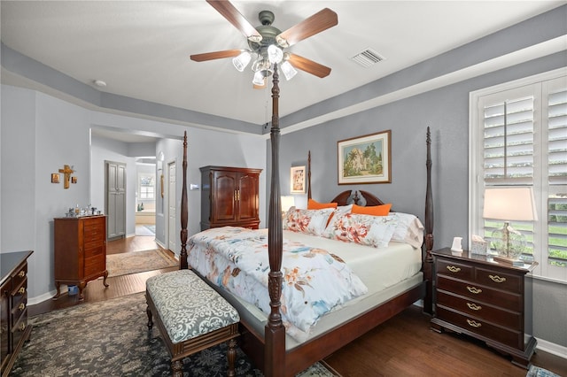 bedroom featuring ceiling fan and dark hardwood / wood-style flooring