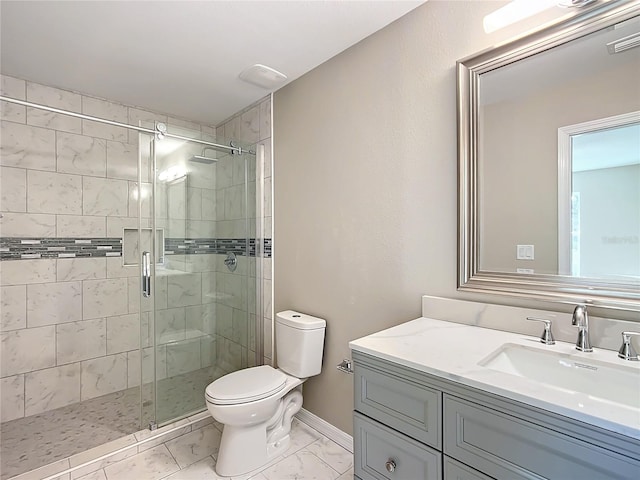 bathroom featuring toilet, an enclosed shower, and vanity