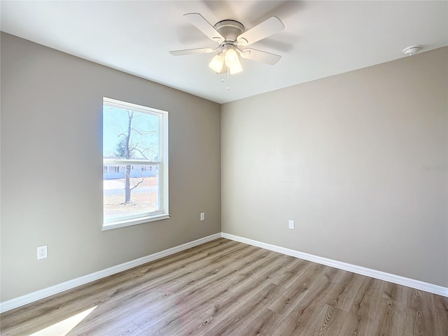 spare room with ceiling fan and light hardwood / wood-style flooring