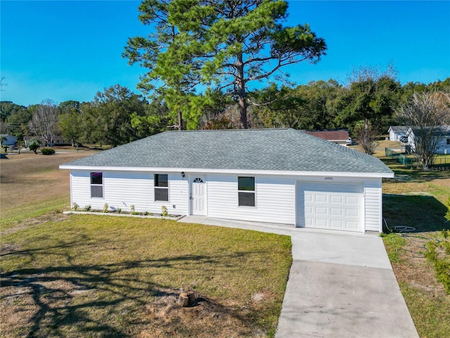 single story home featuring a front lawn and a garage