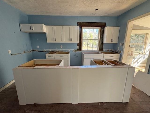 kitchen featuring a center island and white cabinets