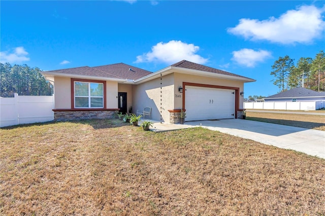 ranch-style house featuring driveway, a front yard, fence, and stucco siding