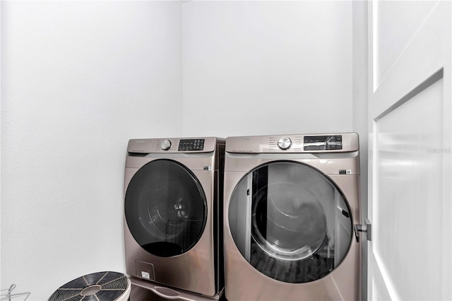 laundry area with laundry area and independent washer and dryer