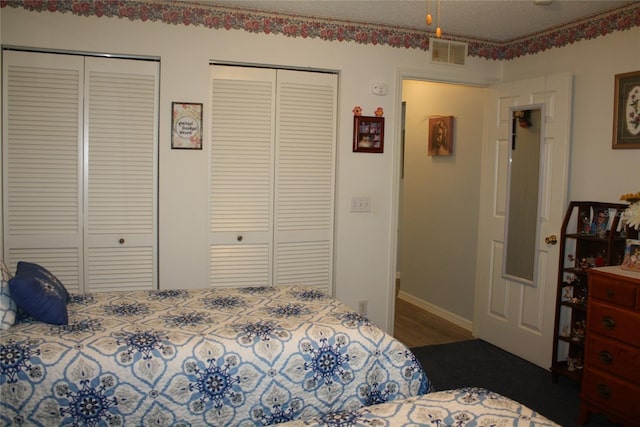 bedroom with two closets