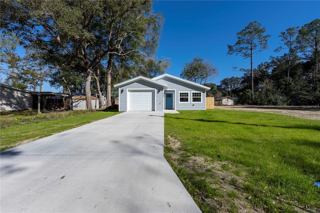 single story home featuring a front lawn and a garage