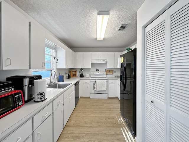 kitchen with black appliances, sink, white cabinetry, light hardwood / wood-style flooring, and a textured ceiling