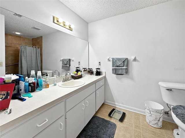 bathroom featuring toilet, vanity, tile patterned flooring, a textured ceiling, and curtained shower