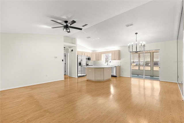 unfurnished living room with ceiling fan with notable chandelier, light hardwood / wood-style flooring, lofted ceiling, and sink