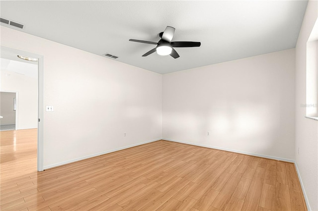 unfurnished room featuring ceiling fan and light wood-type flooring