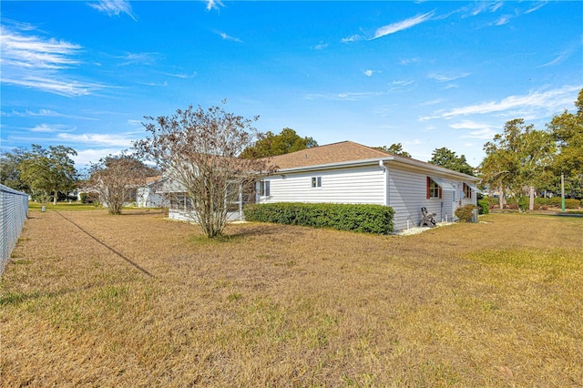 view of home's exterior featuring a yard