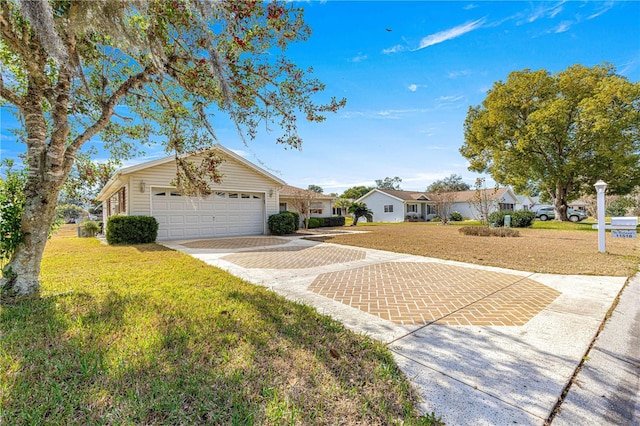 ranch-style house featuring a garage and a front lawn