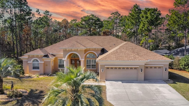 mediterranean / spanish-style home featuring a garage