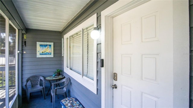 doorway to property featuring a porch