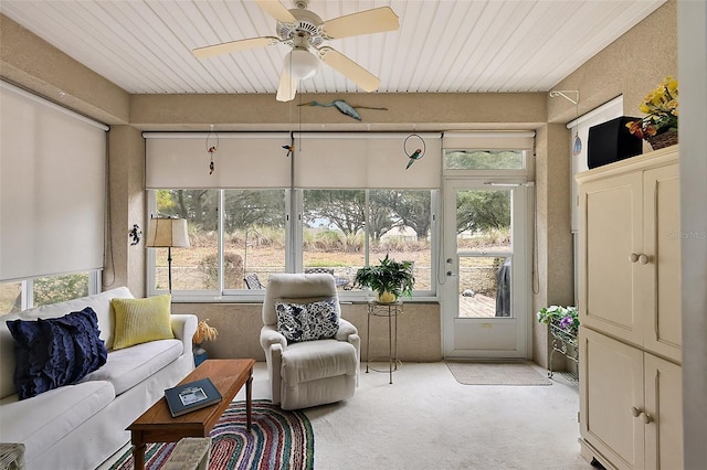 sunroom featuring ceiling fan