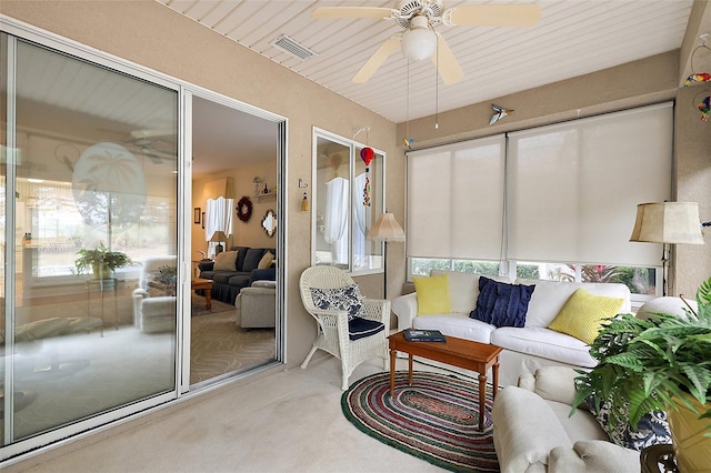 sunroom / solarium featuring ceiling fan