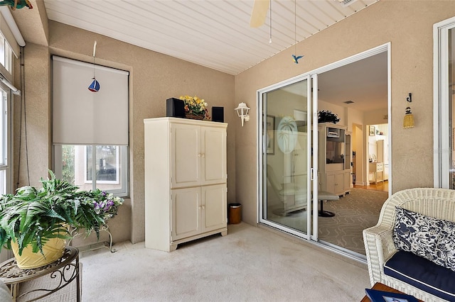 interior space featuring ceiling fan