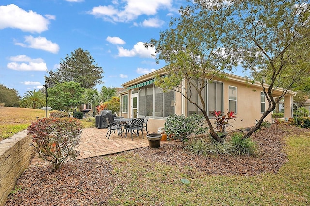 back of house featuring a patio