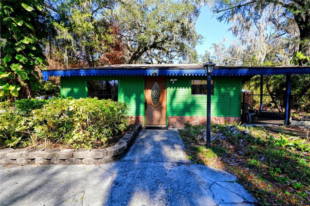 entrance to property with a carport