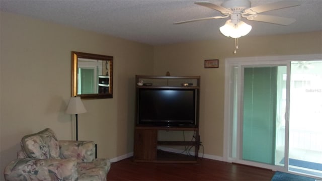 unfurnished living room featuring hardwood / wood-style flooring and ceiling fan