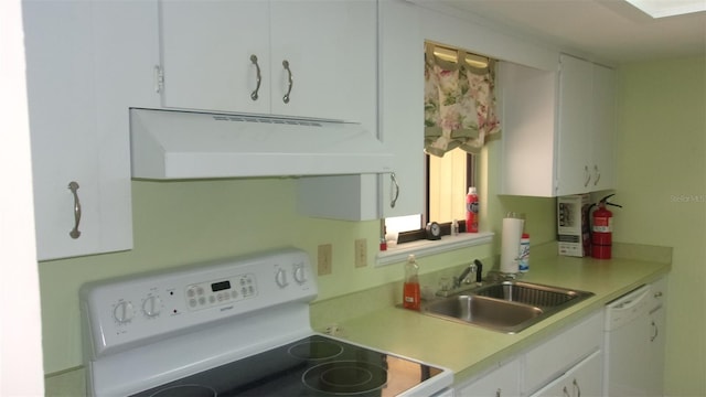 kitchen with white cabinets, stove, sink, and white dishwasher