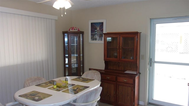 dining room featuring ceiling fan