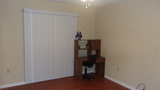 unfurnished room featuring dark wood-type flooring