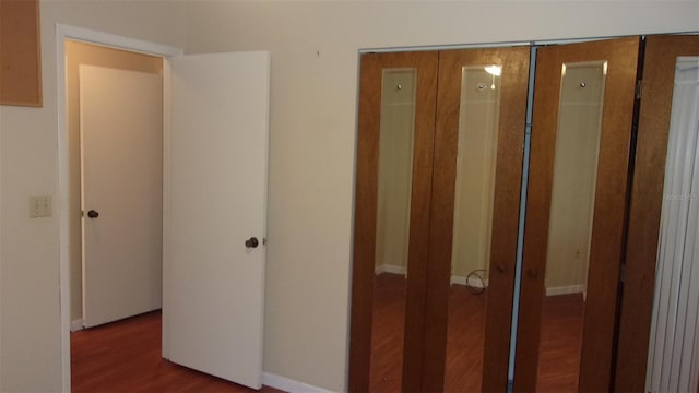 corridor featuring hardwood / wood-style flooring