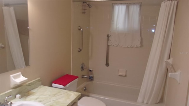 full bathroom featuring shower / tub combo, vanity, and toilet