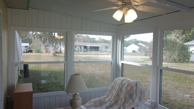 sunroom featuring ceiling fan