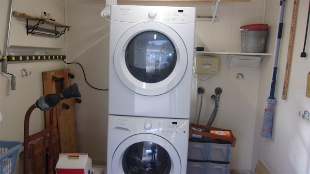 laundry room featuring stacked washing maching and dryer