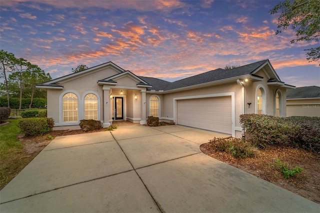 ranch-style home featuring a garage