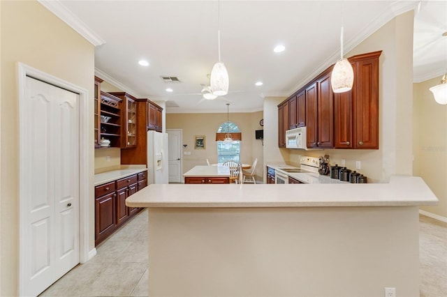 kitchen with white appliances, crown molding, hanging light fixtures, and kitchen peninsula